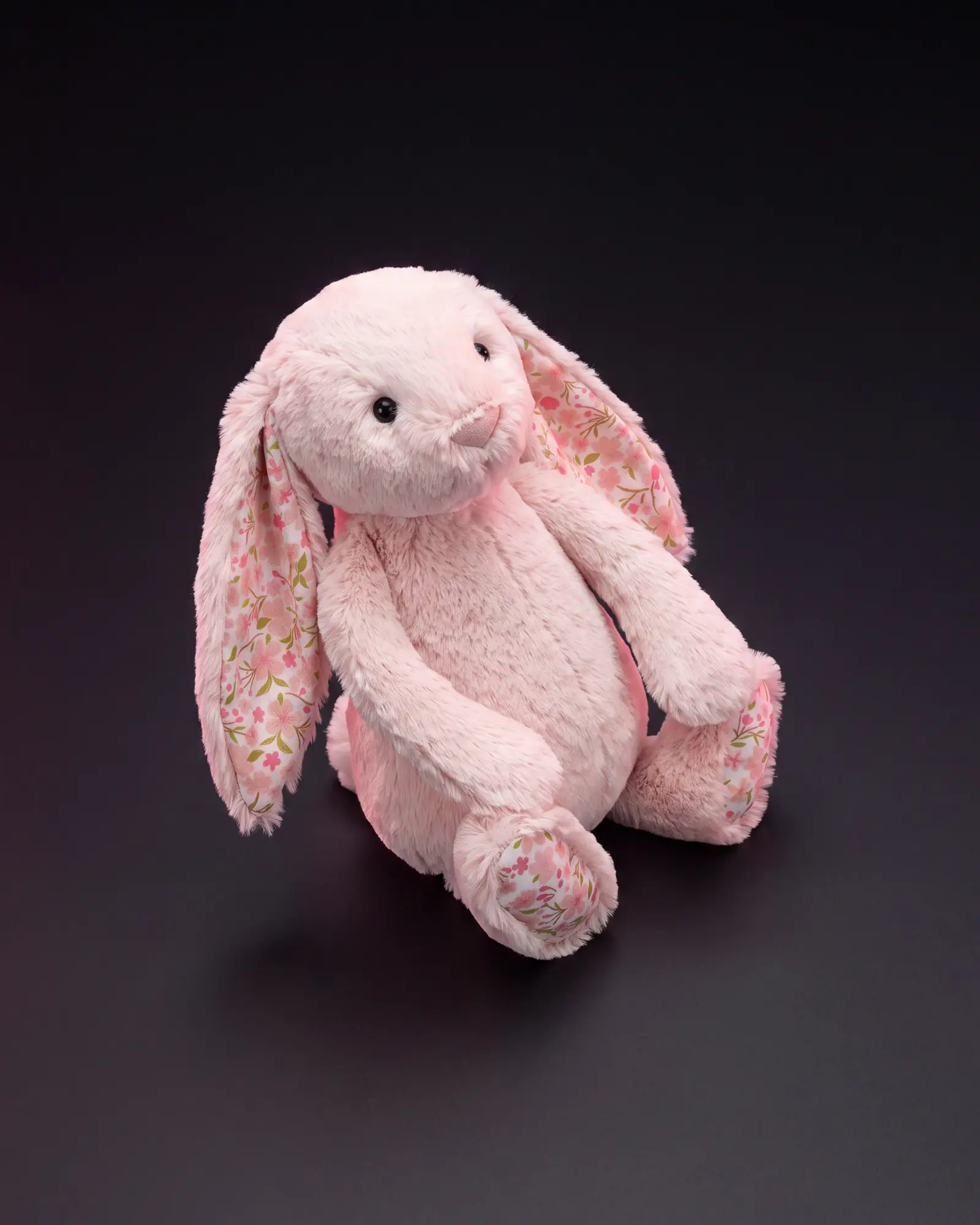 Blossom Blush Bunny 'Cherry' on a dark studio background.