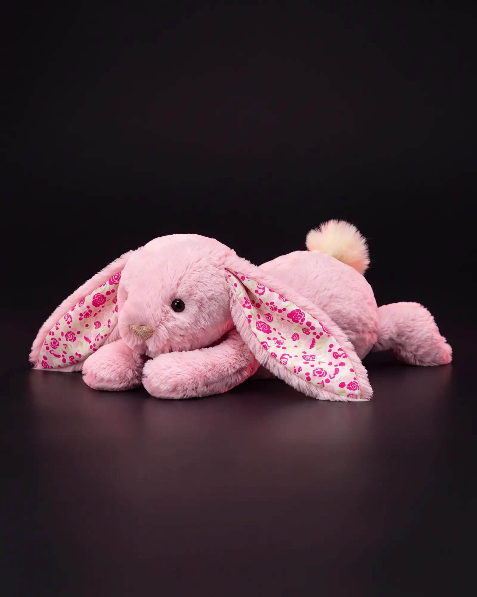 Blushkin Blossom Luxe Bunny on a dark studio background.