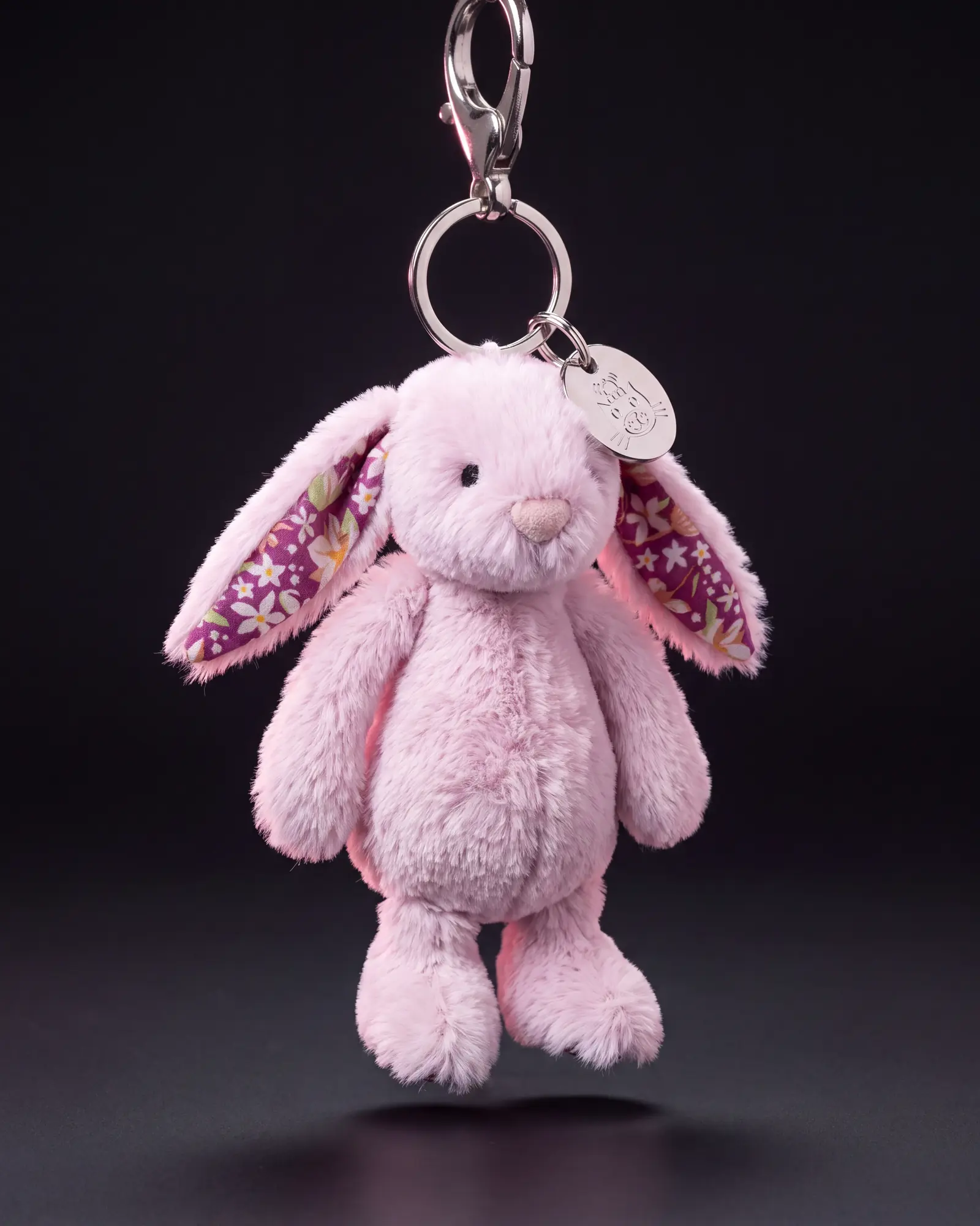 Thistlepop Blossom Bunny Bag Charm on a dark studio background.